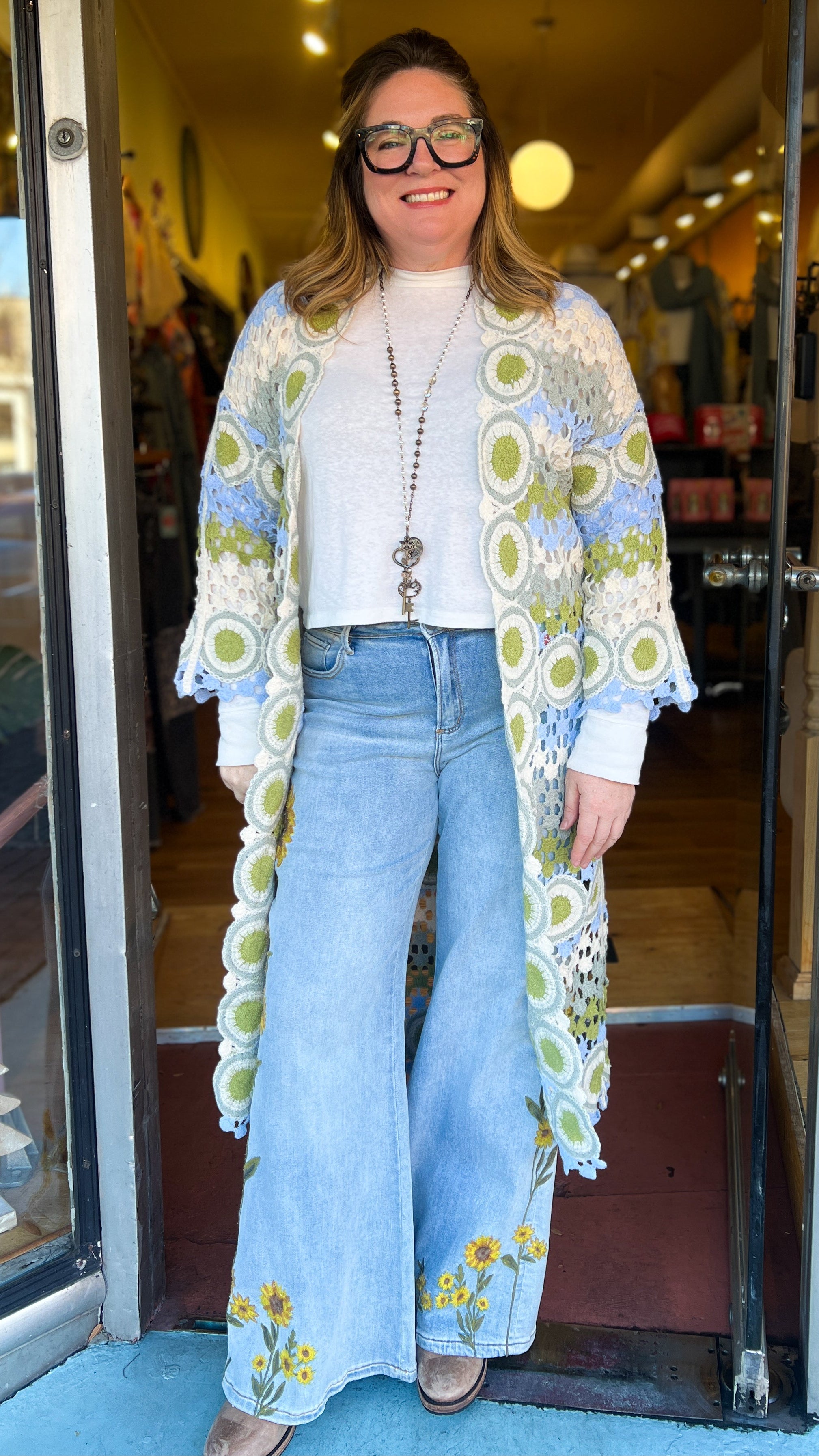 Blue and green crochet granny square sweater